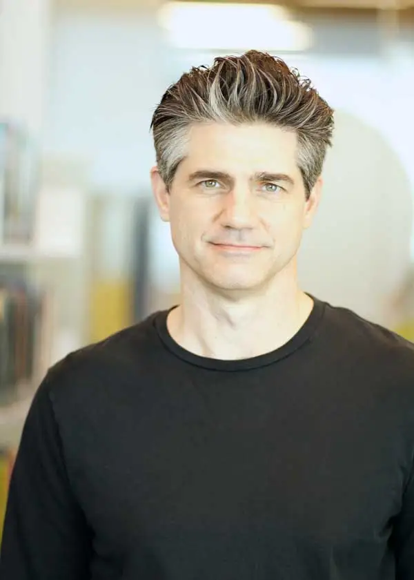 Joshua Becker with short salt and pepper hair wearing a black t-shirt.